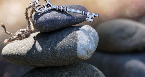 Canva - Key on a rock