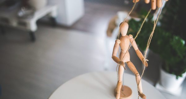 Canva - Small Wooden Puppet