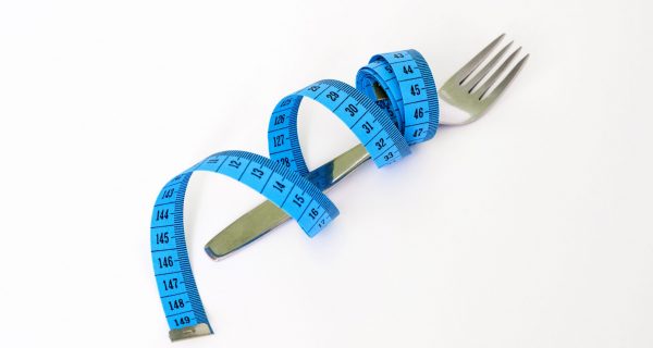 cropped-Canva-Blue-and-Black-Measuring-Tape-Wrapped-Around-a-Silver-Metal-Fork.jpg