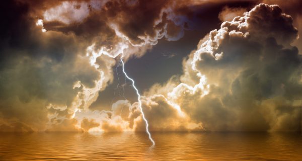 cropped-Canva-Lightning-over-water-through-ominous-sky.jpg