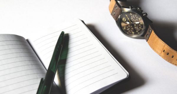 Canva - Pen on Notebook Beside Chronograph Watch